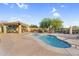 Beautifully landscaped pool area with shaded seating and lounge areas for relaxation and enjoyment at 3859 N El Sereno St, Mesa, AZ 85207