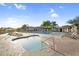 Gorgeous community pools featuring a spa, comfortable lounge chairs, and lush desert landscaping at 3859 N El Sereno St, Mesa, AZ 85207