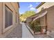 Landscaped side yard with a walkway, adding a touch of greenery and charm to the property at 3859 N El Sereno St, Mesa, AZ 85207
