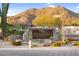 Community signage for Whispering Ridge with desert landscape and mountain views in the background at 3859 N El Sereno St, Mesa, AZ 85207