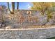 Las Sendas Mountain community signage featuring a stone wall and desert landscaping at 3859 N El Sereno St, Mesa, AZ 85207