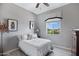 Cozy bedroom featuring a comfortable bed with soft lighting and calming neutral tones at 41465 W Sussex Dr, Maricopa, AZ 85138