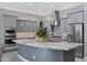 Open kitchen with stainless steel appliances, granite countertops, and abundant cabinet space at 41465 W Sussex Dr, Maricopa, AZ 85138