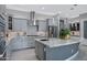 Well-appointed kitchen featuring granite countertops, stainless steel appliances, and ample storage at 41465 W Sussex Dr, Maricopa, AZ 85138