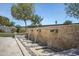 Close up of backyard water feature, desert landscaping, and stone patio at 41465 W Sussex Dr, Maricopa, AZ 85138