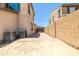 A spacious backyard area with brick-paved patio and block fence, ready for landscaping at 4277 N 180Th Ln, Goodyear, AZ 85395