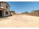 Large backyard with dirt landscaping and perimeter fencing at 4277 N 180Th Ln, Goodyear, AZ 85395