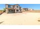 Large backyard with dirt landscaping and fencing against neighboring homes at 4277 N 180Th Ln, Goodyear, AZ 85395