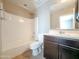 Clean bathroom design showcasing a combination tub and shower, a single vanity, and neutral color palette at 4277 N 180Th Ln, Goodyear, AZ 85395
