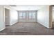 Bedroom featuring large windows and neutral carpet flooring at 4277 N 180Th Ln, Goodyear, AZ 85395