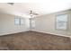 Spacious bedroom with carpeting and multiple windows for natural light at 4277 N 180Th Ln, Goodyear, AZ 85395