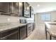 A close up view of the kitchen with stainless steel appliances and granite countertops at 4277 N 180Th Ln, Goodyear, AZ 85395