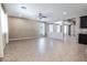 A spacious living room featuring lots of natural light and a ceiling fan at 4277 N 180Th Ln, Goodyear, AZ 85395