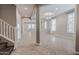 Open-concept living space with neutral walls and tile flooring at 4277 N 180Th Ln, Goodyear, AZ 85395