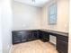 Office area with built-in desk and cabinets offering ample storage at 4277 N 180Th Ln, Goodyear, AZ 85395