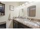 Bright bathroom with double sink vanity and granite countertop at 43935 W Sagebrush Trl, Maricopa, AZ 85138