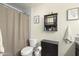 Bathroom featuring a toilet, vanity and shower at 43935 W Sagebrush Trl, Maricopa, AZ 85138