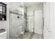 Beautiful bathroom with an enclosed shower and glass doors, along with modern fixtures at 43935 W Sagebrush Trl, Maricopa, AZ 85138