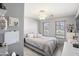 Cozy bedroom with tiled floor, windows, a ceiling fan, and neutral colors at 43935 W Sagebrush Trl, Maricopa, AZ 85138