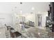 Bright, open kitchen features a large island with seating and a sink at 43935 W Sagebrush Trl, Maricopa, AZ 85138