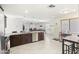 Open concept kitchen with a large island and pendant lighting at 43935 W Sagebrush Trl, Maricopa, AZ 85138