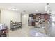 Spacious kitchen featuring stainless steel appliances, an island, and a breakfast bar at 43935 W Sagebrush Trl, Maricopa, AZ 85138