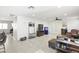 Open-concept living room featuring tile flooring, modern lighting, and stylish furniture at 43935 W Sagebrush Trl, Maricopa, AZ 85138