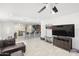 Open floor plan with living room leading into kitchen and dining area at 43935 W Sagebrush Trl, Maricopa, AZ 85138