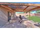 Spacious covered patio offers an outdoor space for entertainment at 43935 W Sagebrush Trl, Maricopa, AZ 85138