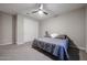 Simple yet cozy bedroom with a comfortable bed, neutral colors, and ample closet space at 4593 W Bush Bean Way, San Tan Valley, AZ 85144
