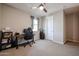 A carpeted bedroom featuring a window with curtains and a closet door; neutral gray paint at 4593 W Bush Bean Way, San Tan Valley, AZ 85144