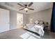 Cozy bedroom with neutral colors, a comfortable bed, and an ensuite bathroom view at 4593 W Bush Bean Way, San Tan Valley, AZ 85144