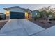 Charming single-story home with a two-car garage, desert landscaping, and appealing stone accents at 4593 W Bush Bean Way, San Tan Valley, AZ 85144