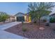 Well-kept single-story home boasts desert landscaping, a two-car garage, and a welcoming facade at 4593 W Bush Bean Way, San Tan Valley, AZ 85144