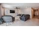 Comfortable living room with a plush sofa, recliner, and stylish rug at 4593 W Bush Bean Way, San Tan Valley, AZ 85144