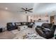 Cozy living room with an open layout connecting to the kitchen, perfect for entertaining guests at 4593 W Bush Bean Way, San Tan Valley, AZ 85144