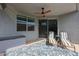 Inviting covered patio with comfortable seating and a ceiling fan overlooking the backyard at 4593 W Bush Bean Way, San Tan Valley, AZ 85144