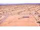 Expansive lot with new single story home, encircled by a chain-link fence, set in a sparse desert environment at 47654 W Venado Rd, Maricopa, AZ 85139