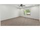 Bright bedroom with plush carpeting, ceiling fan, recessed lighting, and lots of natural light at 5232 N 186Th Dr, Litchfield Park, AZ 85340