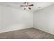 Bright bedroom features carpeting and ceiling fan for comfort at 5232 N 186Th Dr, Litchfield Park, AZ 85340