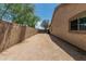 Long driveway alongside the house leads to a gated area, offering ample parking and potential storage space at 5232 N 186Th Dr, Litchfield Park, AZ 85340