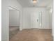 Bright foyer with tile flooring, white door, and natural light streaming through side window at 5232 N 186Th Dr, Litchfield Park, AZ 85340