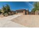 Charming single-story home with desert landscaping, driveway, and a two-car garage at 5232 N 186Th Dr, Litchfield Park, AZ 85340