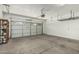 Spacious garage with ample storage and high ceilings ready for projects and parking, well lit with garage door opener at 5232 N 186Th Dr, Litchfield Park, AZ 85340