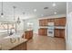 Spacious open concept kitchen with granite counters and stainless steel appliances at 5232 N 186Th Dr, Litchfield Park, AZ 85340