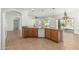 Modern kitchen with granite countertops, wooden cabinetry, and stainless steel appliances at 5232 N 186Th Dr, Litchfield Park, AZ 85340