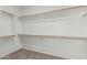 Walk-in closet with ample shelving and rod space for organization at 5232 N 186Th Dr, Litchfield Park, AZ 85340