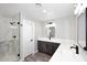 Bathroom showcases sleek shower, contemporary cabinets, and double vanity at 6254 E Winchcomb Dr, Scottsdale, AZ 85254