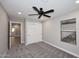 This bedroom has soft carpet and bright natural light from the window at 6254 E Winchcomb Dr, Scottsdale, AZ 85254