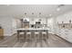 An eat-in kitchen with a large island and modern appliances at 6254 E Winchcomb Dr, Scottsdale, AZ 85254